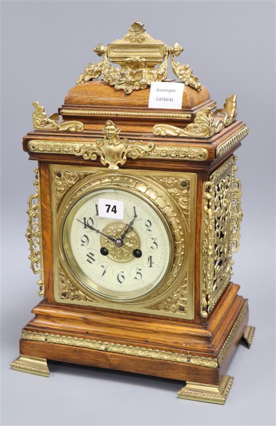 A late 19th century French cast brass mounted rosewood eight day mantel clock height 43cm